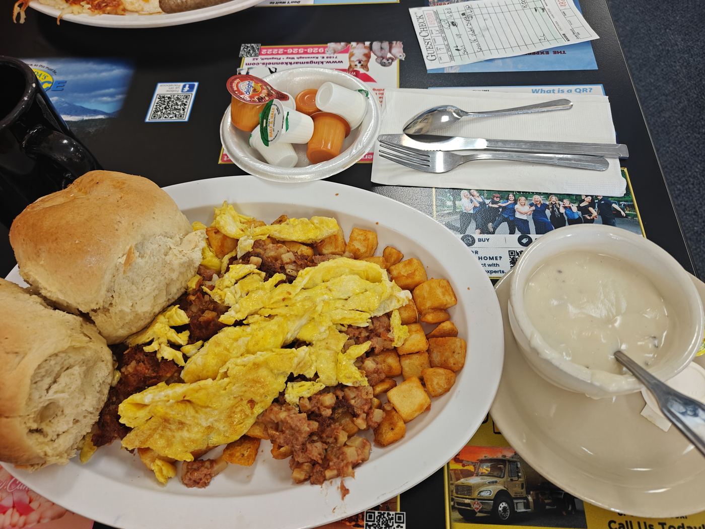 Corned beef hash with scrambled eggs, potatoes, biscuits and gravy